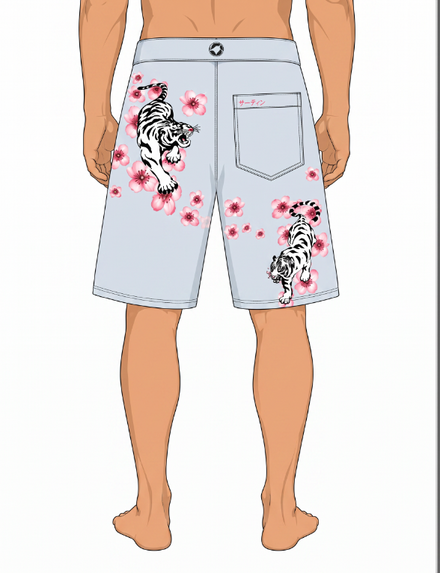 A digital mockup of a model wearing light blue board shorts with white and black tiger prints and pink cherry blossoms, shown from the back against a white background.